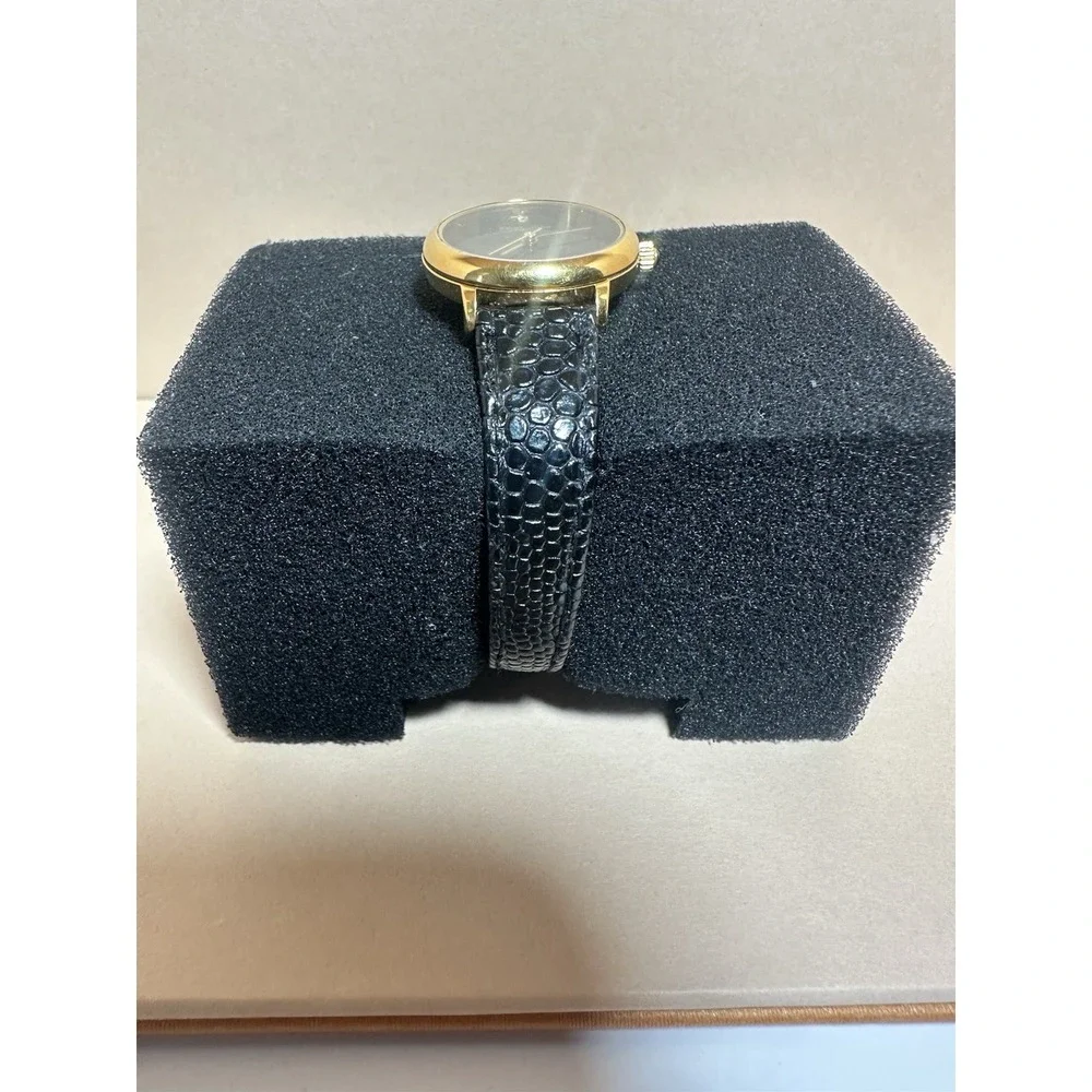 Oleg Cassini Women's Quartz Watch 25.4mm Gold Tone Leather Band‎